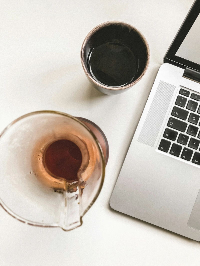 table with laptop and coffee mug